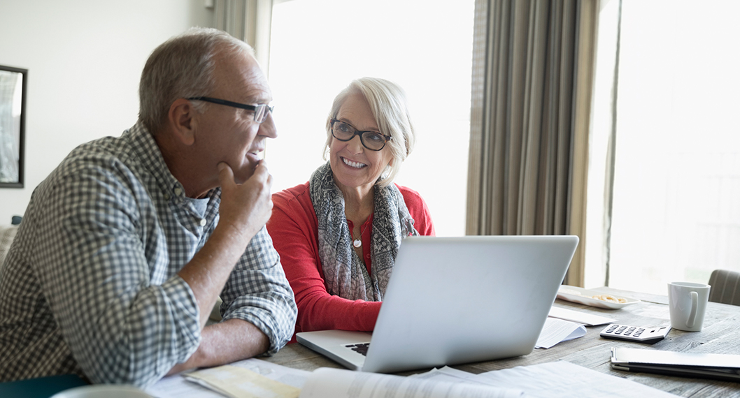 A retiring couple researching and getting answers to what is Medicare 